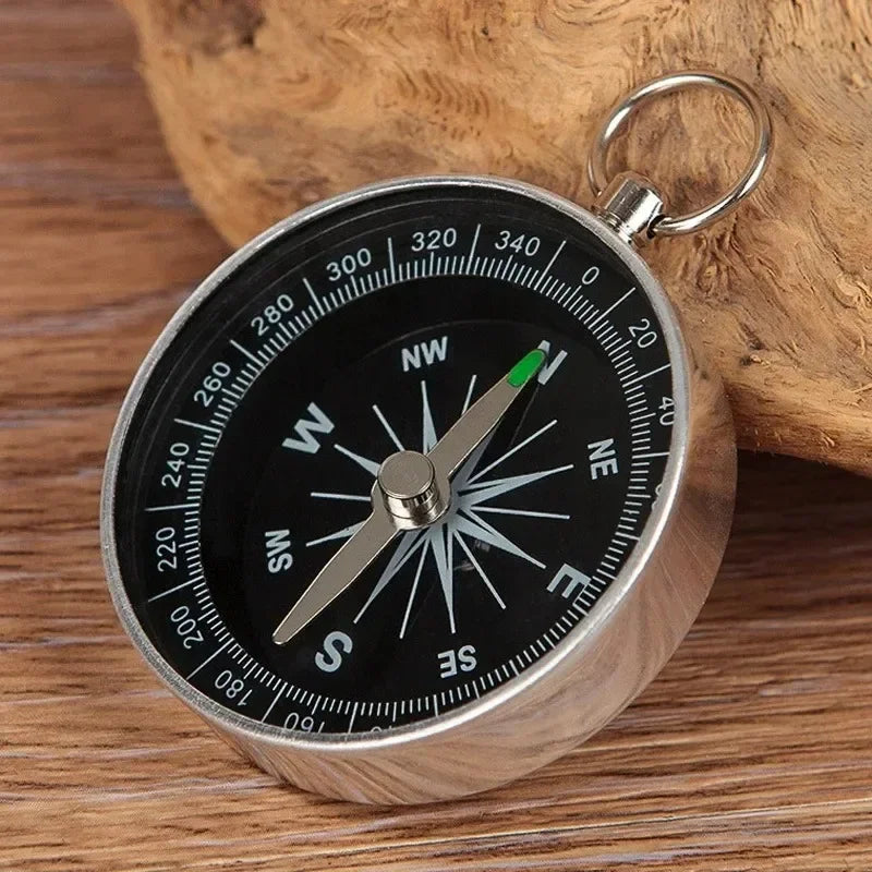 Compact pocket compass with key ring attachment for hiking and camping