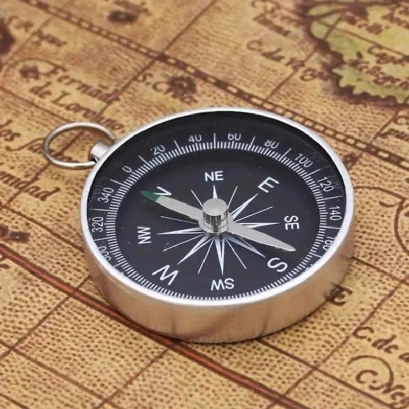 Compact pocket compass with key ring attachment for hiking and camping