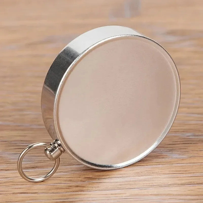 Compact pocket compass with key ring attachment for hiking and camping