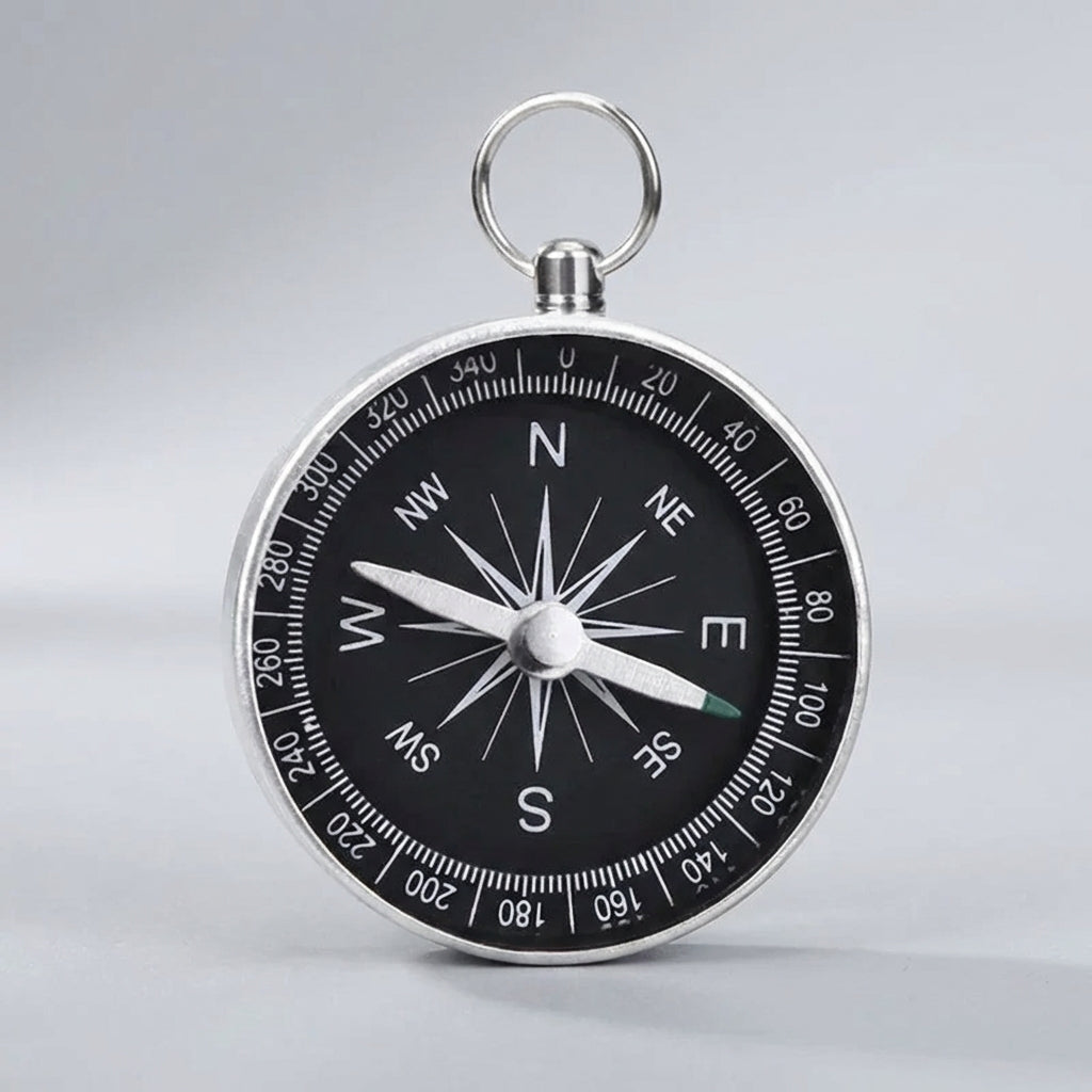 Compact pocket compass with key ring attachment for hiking and camping
