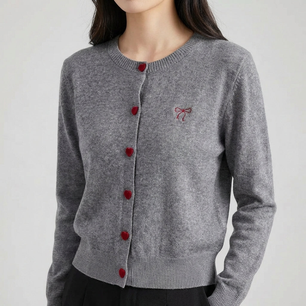 Women's cardigan with heart-shaped buttons and embroidered bow detail