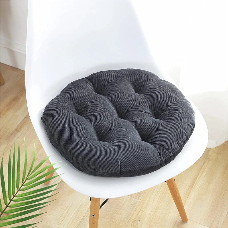 Large round quilted floor cushion with textured corduroy surface