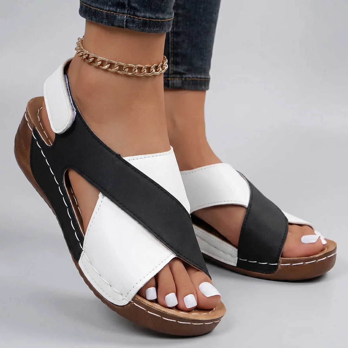 Lightweight wedge sandals with two-tone cross-strap design for summer