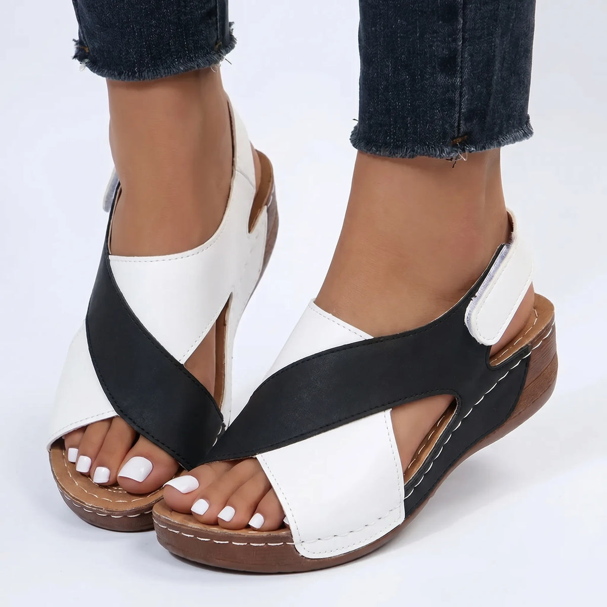 Lightweight wedge sandals with two-tone cross-strap design for summer
