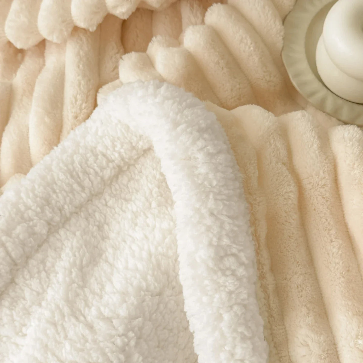 Thick plush throw blanket with soft pile and rib texture