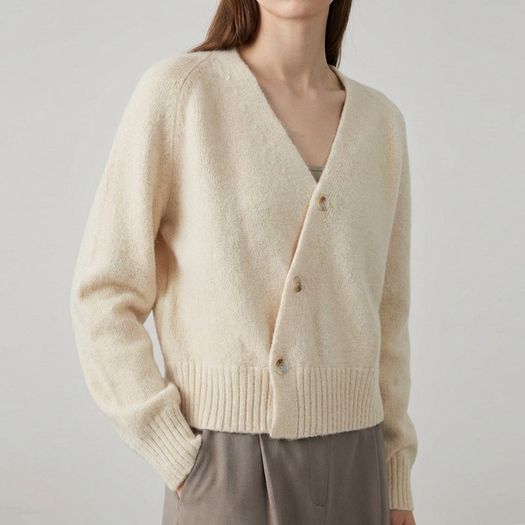 Asymmetric V neck cardigan with skew button front and ribbed hem