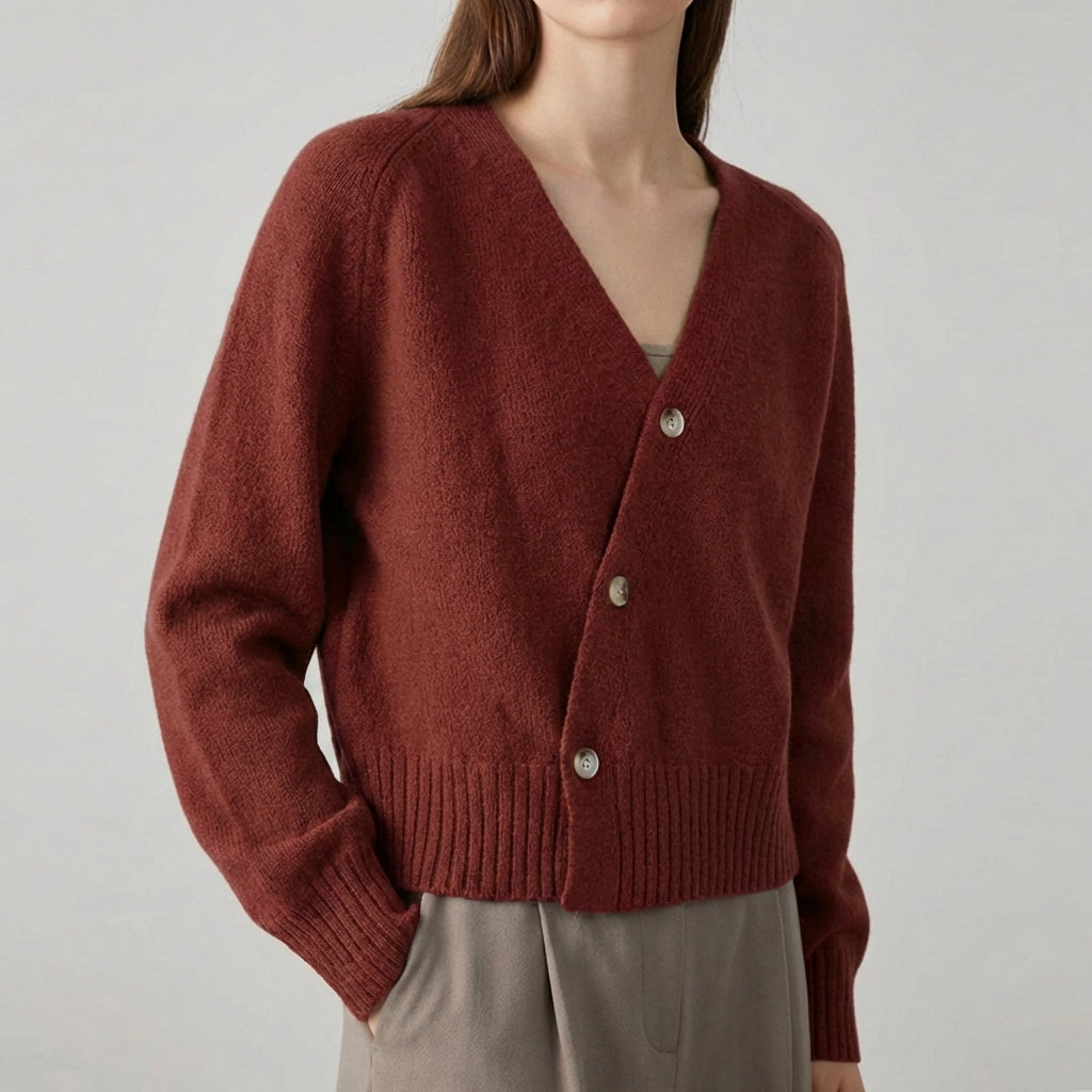 Asymmetric V neck cardigan with skew button front and ribbed hem