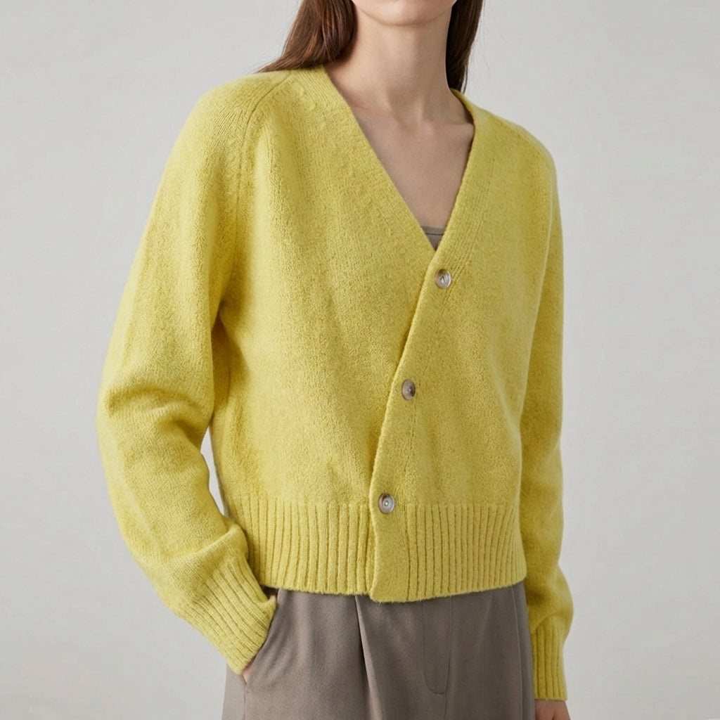 Asymmetric V neck cardigan with skew button front and ribbed hem