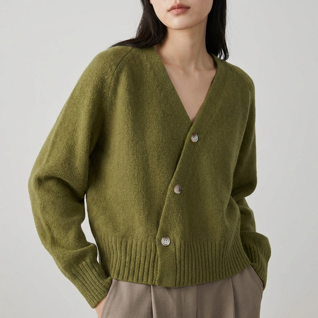 Asymmetric V neck cardigan with skew button front and ribbed hem