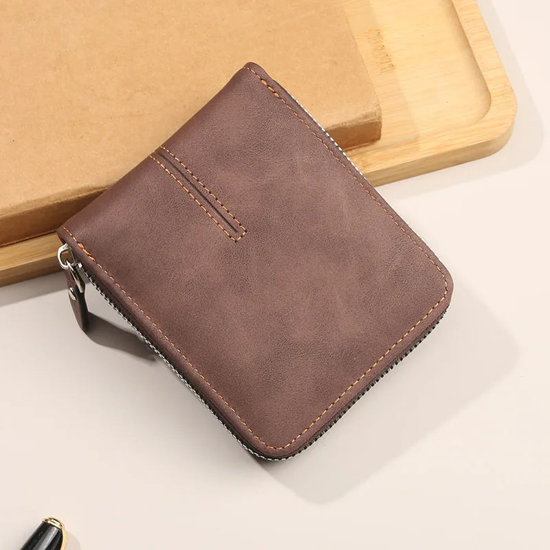 Compact horizontal zip wallet with organised card pockets and retro buckle detail