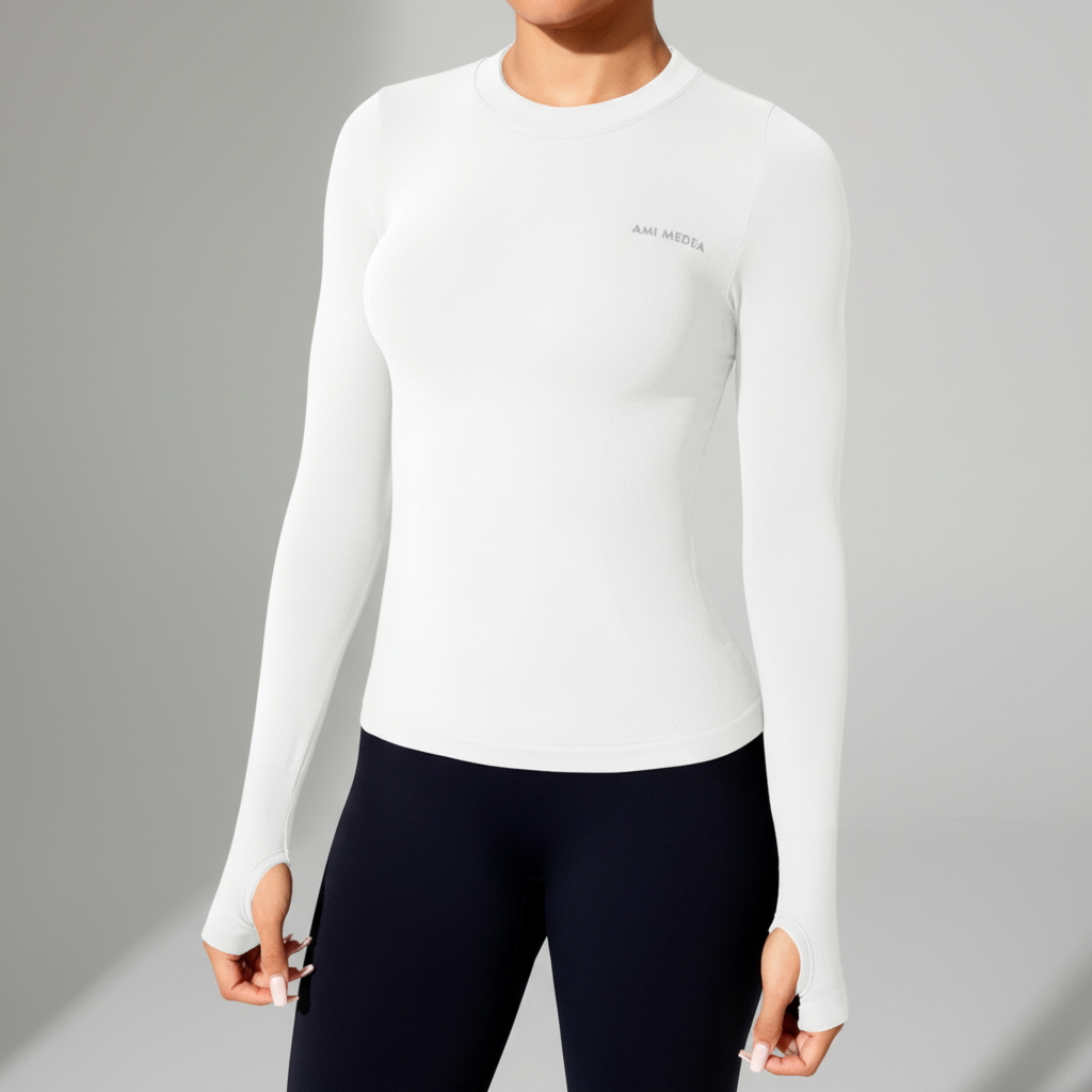 Long sleeve athletic top with seamless construction and thumb cuffs