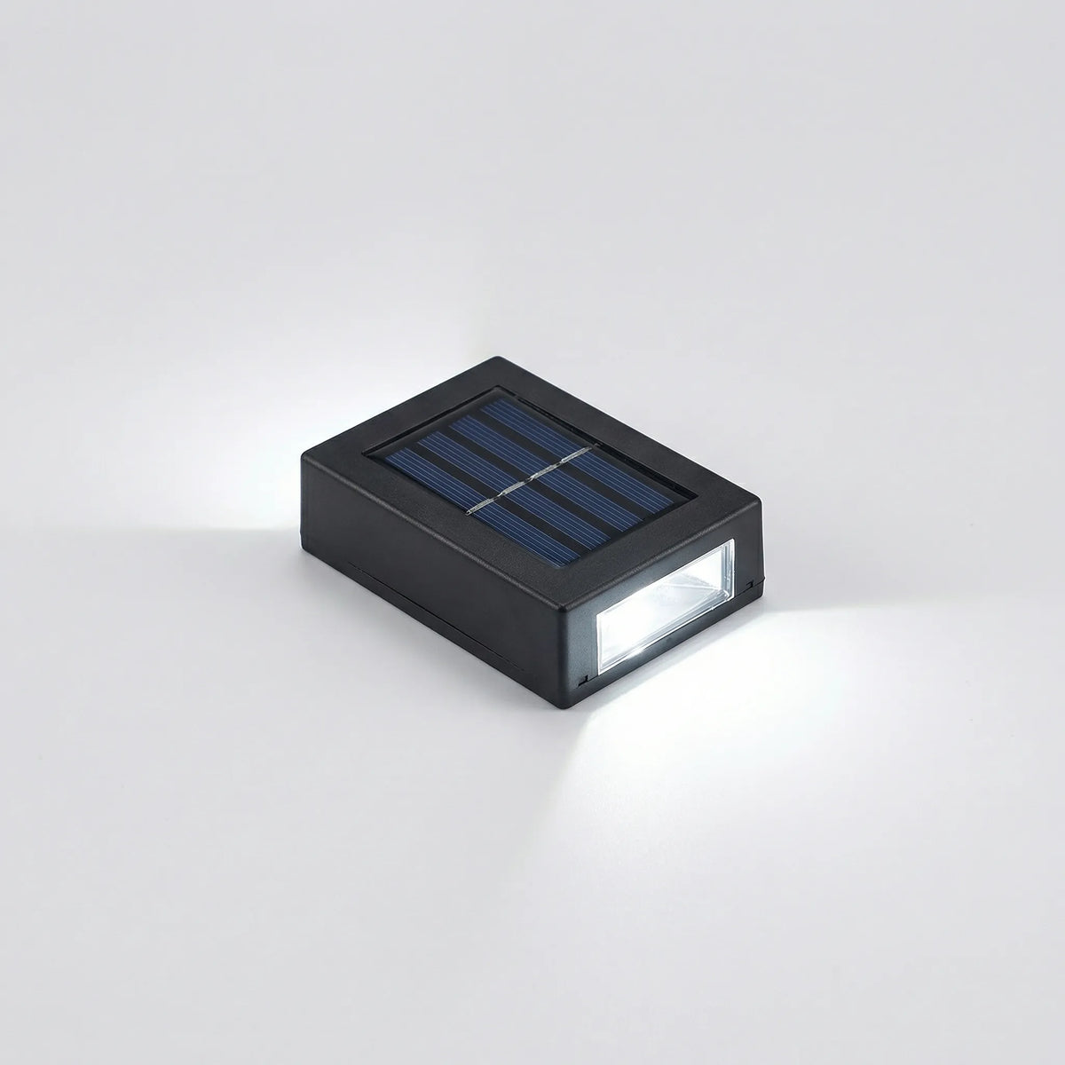 Solar-powered outdoor wall light with dual up-and-down warm glow
