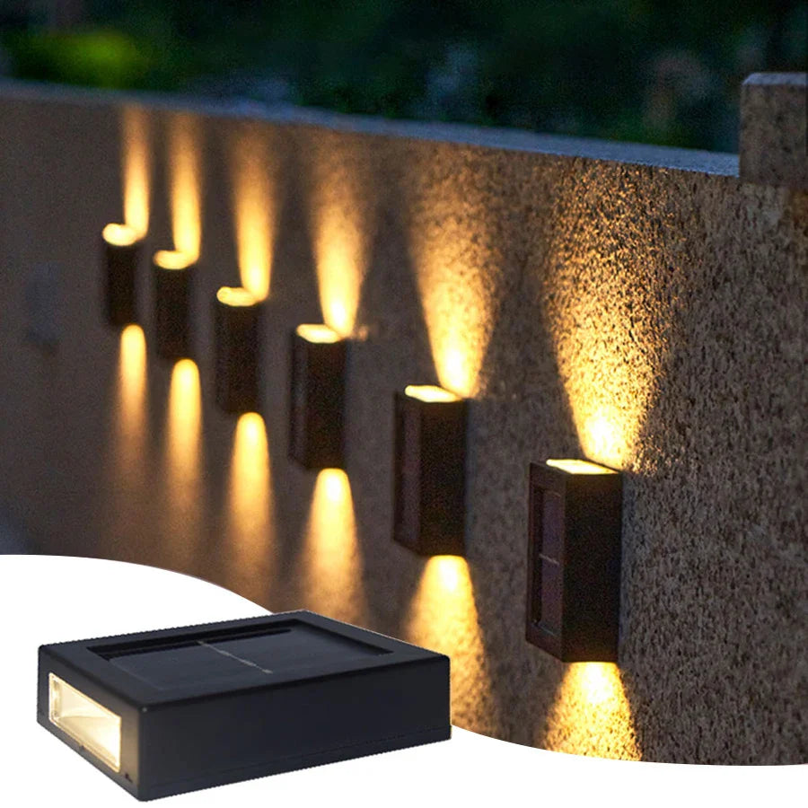 Solar-powered outdoor wall light with dual up-and-down warm glow