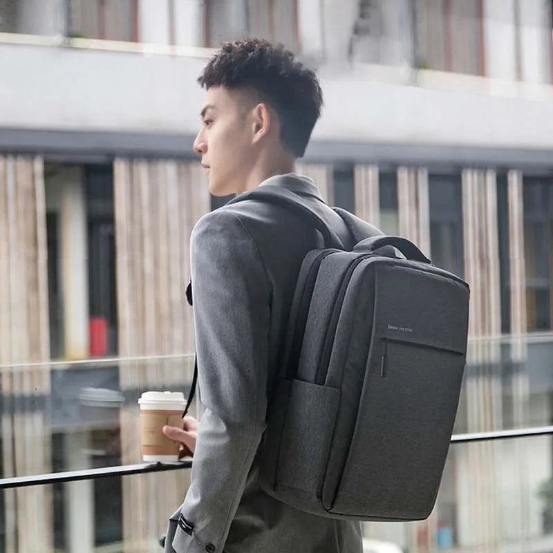 Water-resistant laptop backpack with padded compartment and multiple pockets