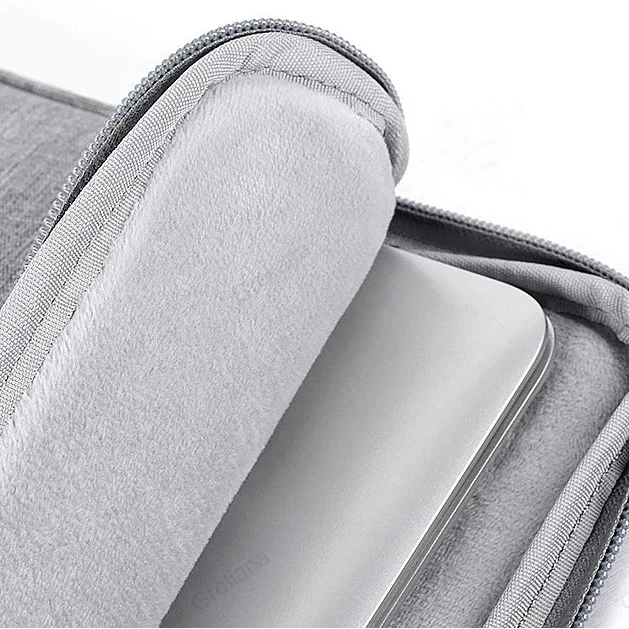 Water-resistant laptop sleeve with padded interior and zip pockets