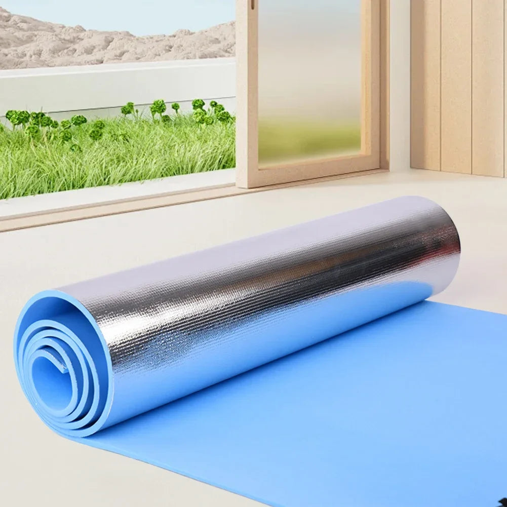 Thick cushioned yoga mat with non-slip surface and portable roll-up design