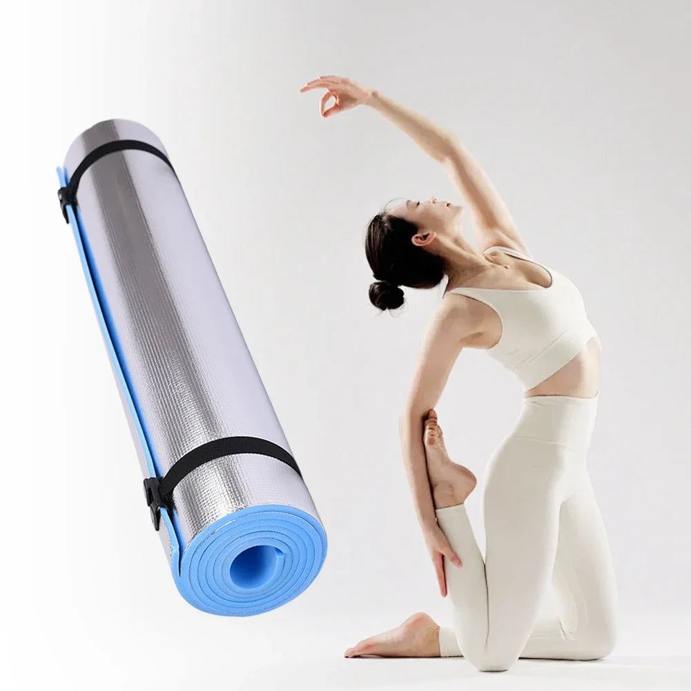 Thick cushioned yoga mat with non-slip surface and portable roll-up design