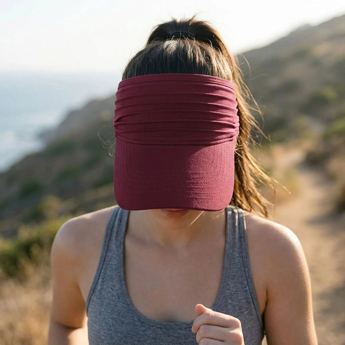 Women's open top sports visor with wide pleated headband and extended peak