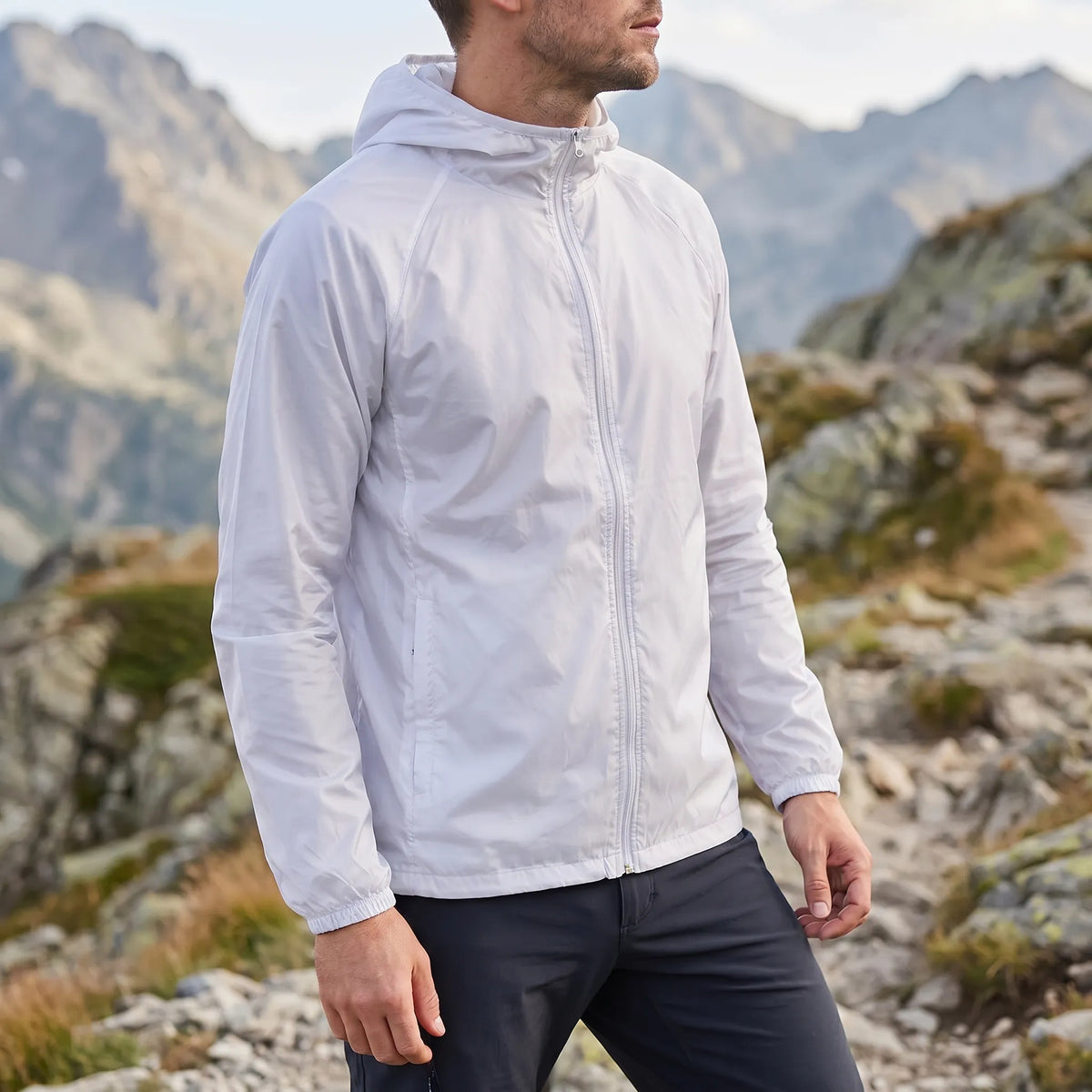 Lightweight packable windbreaker with integrated hood and water-repellent outer