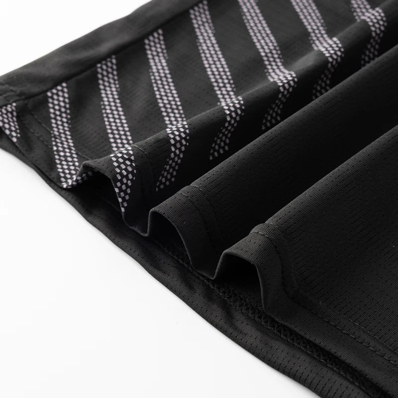 Lightweight running shirt with mesh ventilation and reflective details