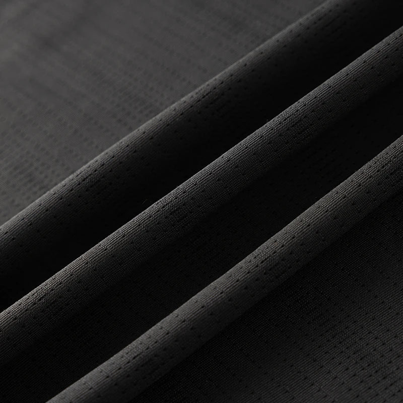 Lightweight running shirt with mesh ventilation and reflective details