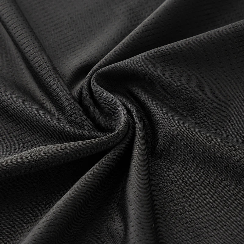 Lightweight running shirt with mesh ventilation and reflective details
