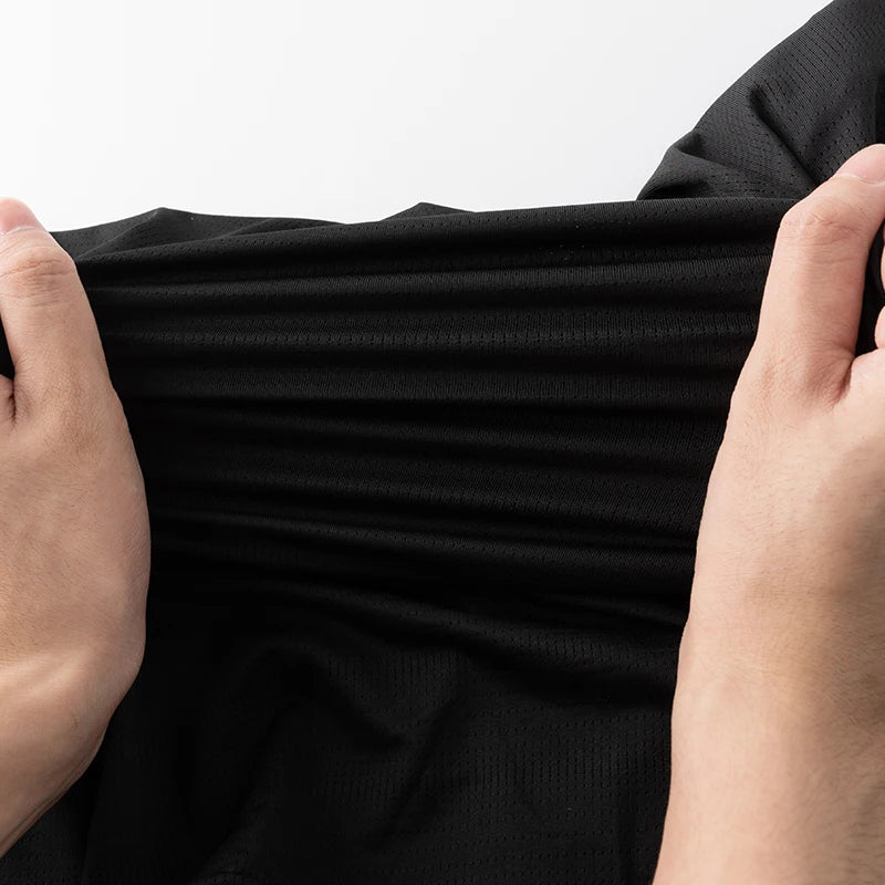 Lightweight running shirt with mesh ventilation and reflective details