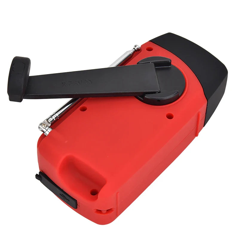 Portable emergency radio with hand crank solar charging and LED torch