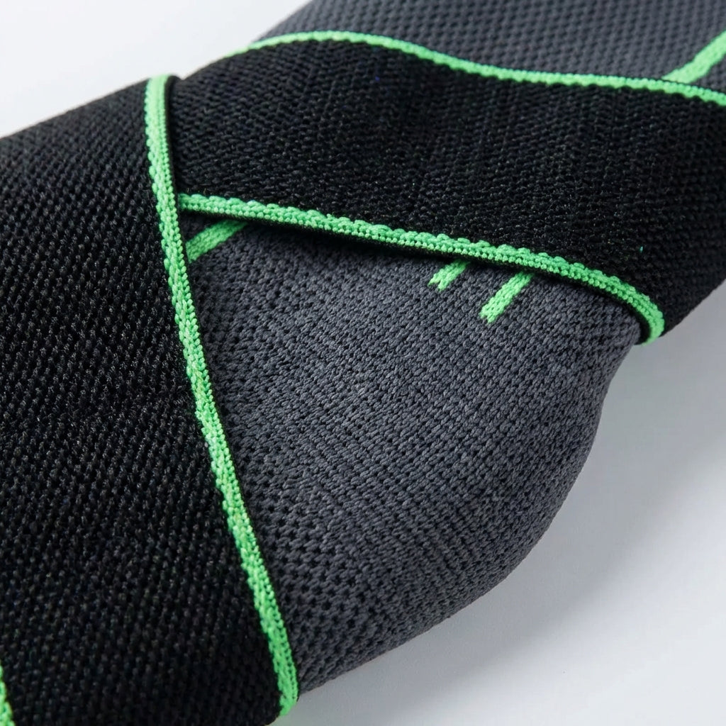Adjustable ankle compression sleeve with cross straps and breathable support