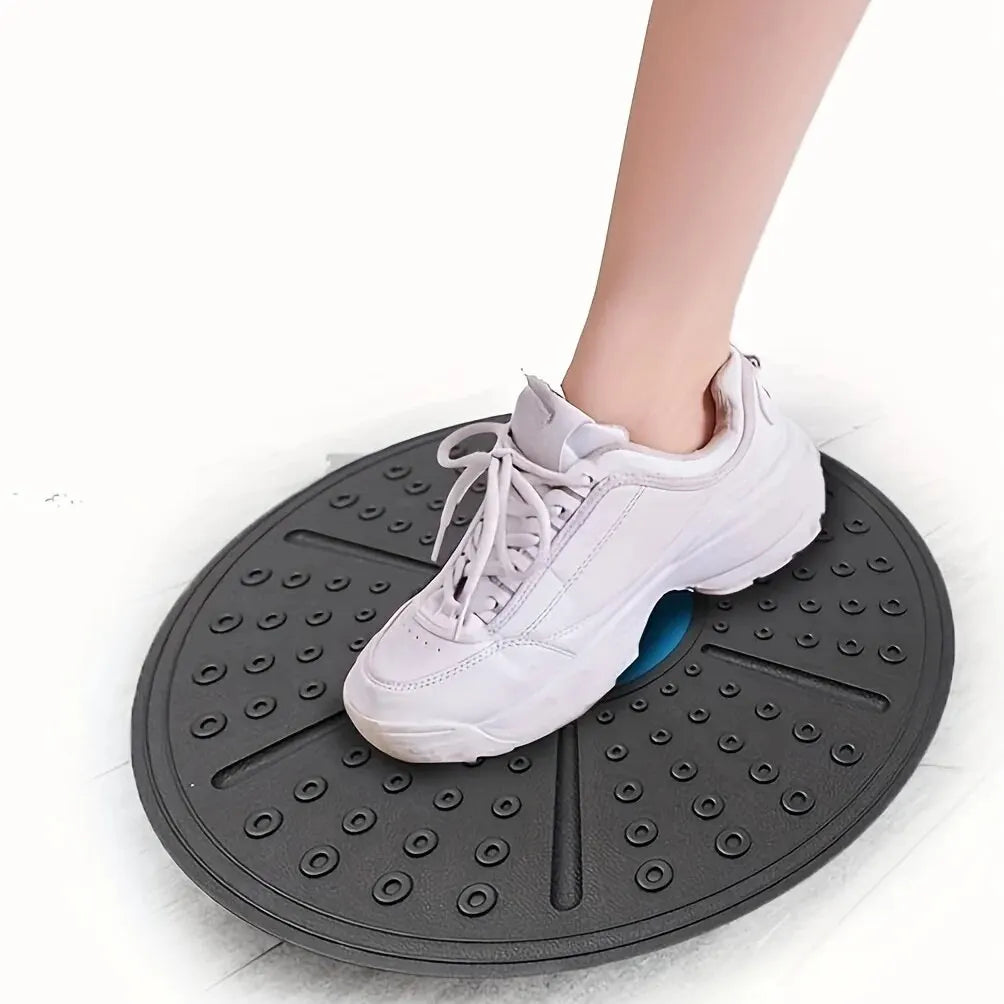 Round rubber balance board with textured traction surface for core strength training