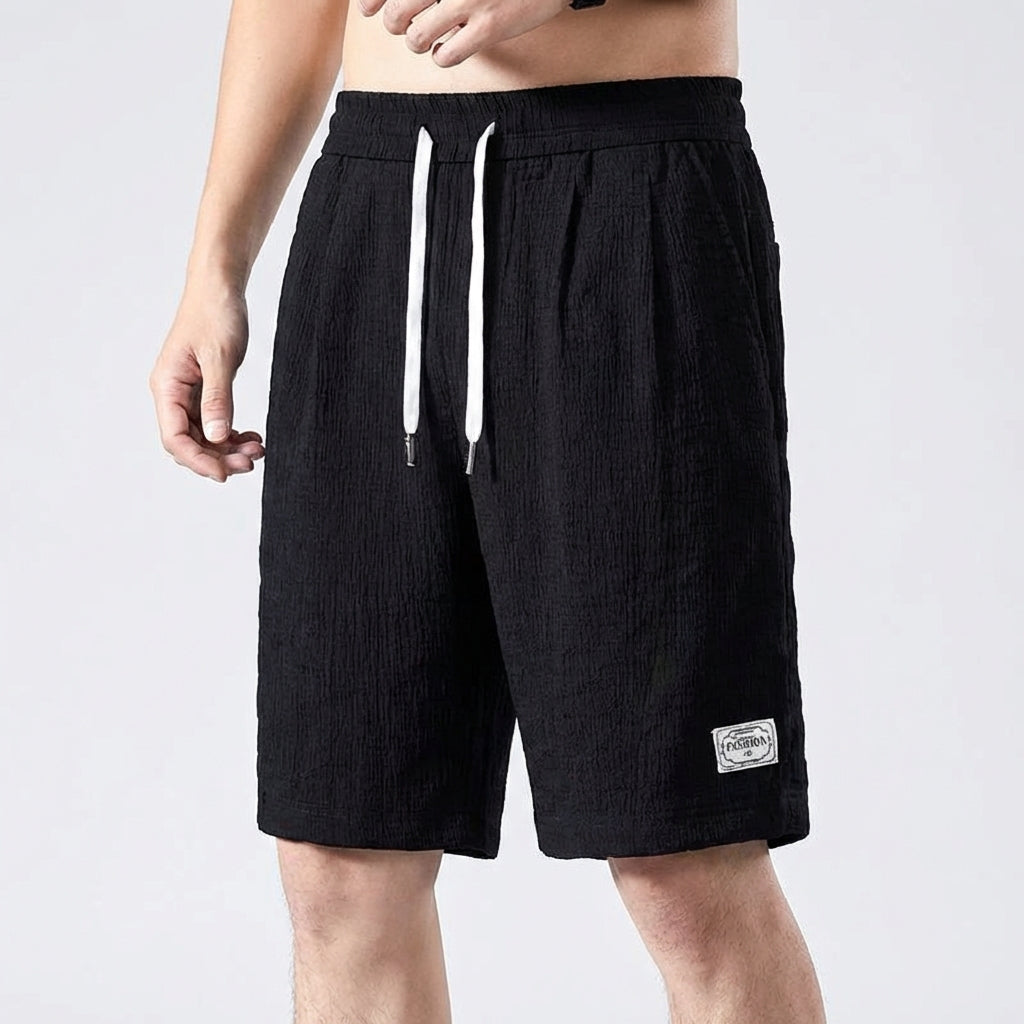 Men's loose-fitting cropped shorts with breathable fabric and side pockets