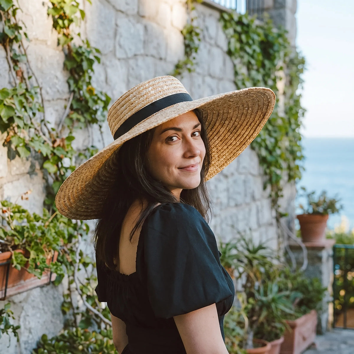 Wide brim sun hat with flat top and breathable woven construction
