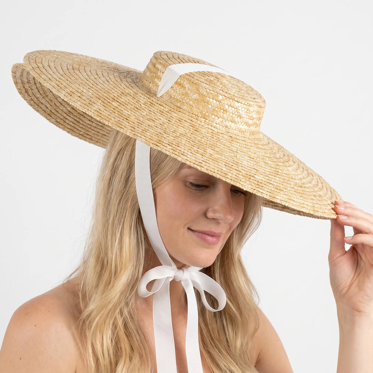 Wide brim sun hat with flat top and breathable woven construction