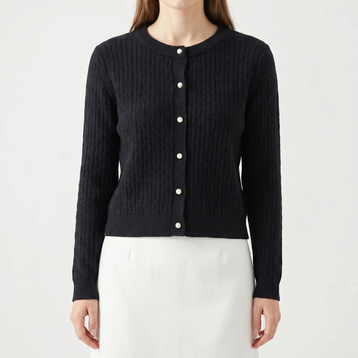 Women's cable knit cardigan with pearl-style buttons and ribbed details