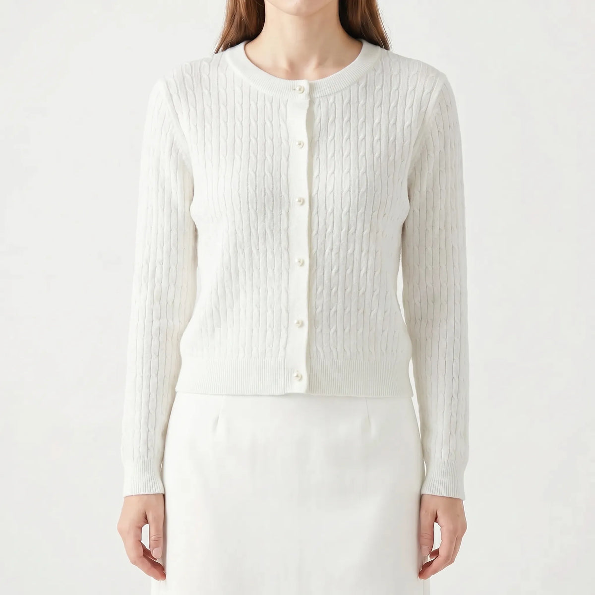 Women's cable knit cardigan with pearl-style buttons and ribbed details