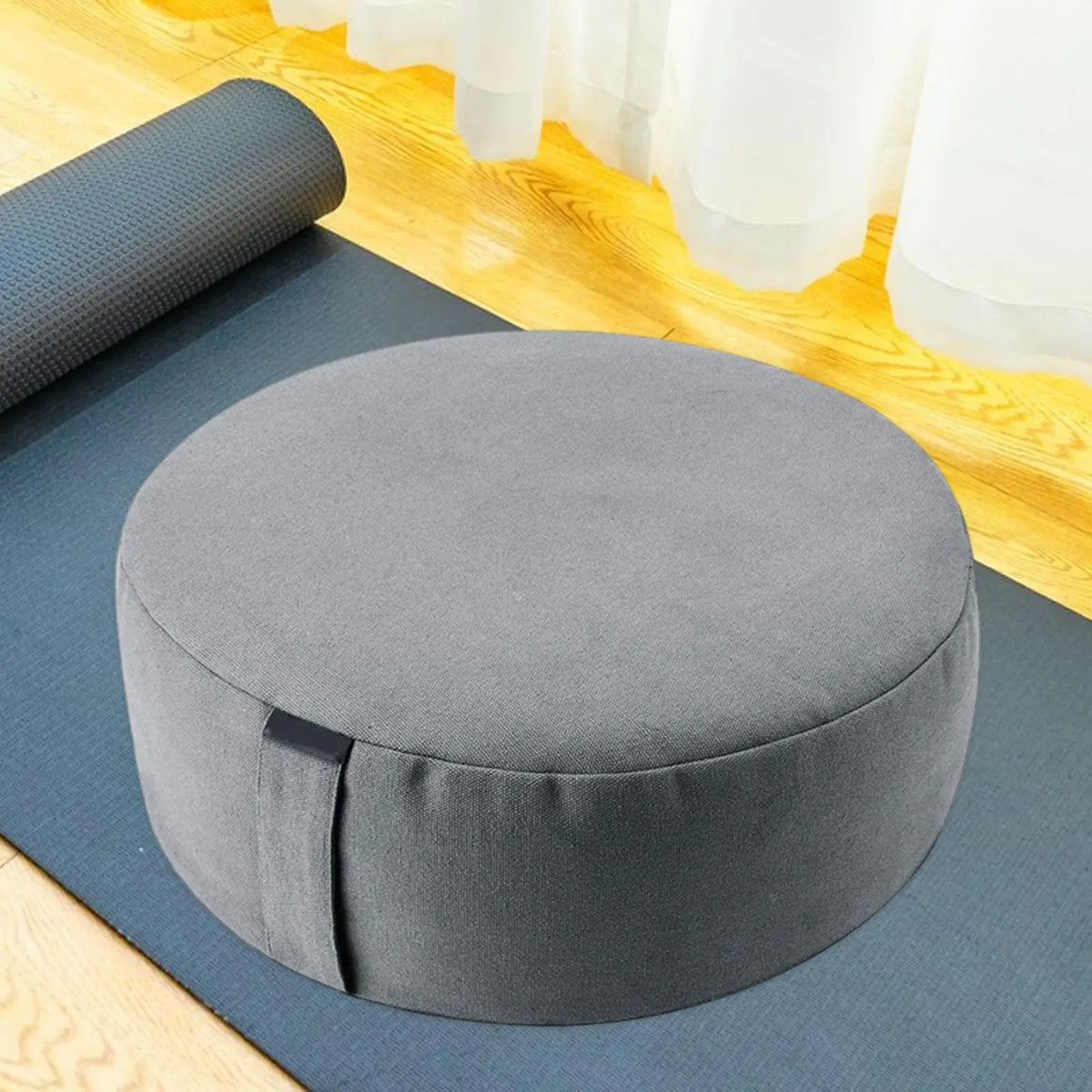 Round meditation cushion with hip elevation support and carry handle