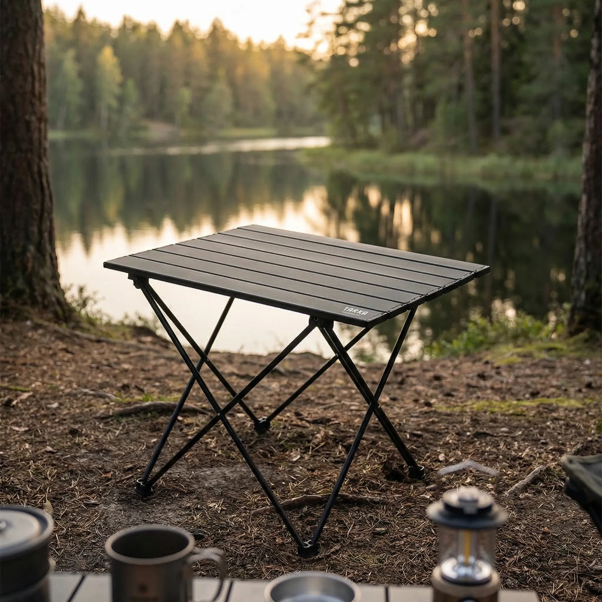 Lightweight folding camping table with slatted surface and carry bag