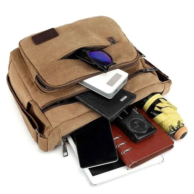 Canvas crossbody messenger bag with adjustable strap and multiple pockets