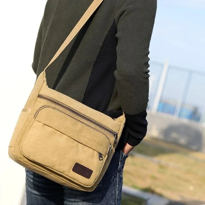 Canvas crossbody messenger bag with adjustable strap and multiple pockets