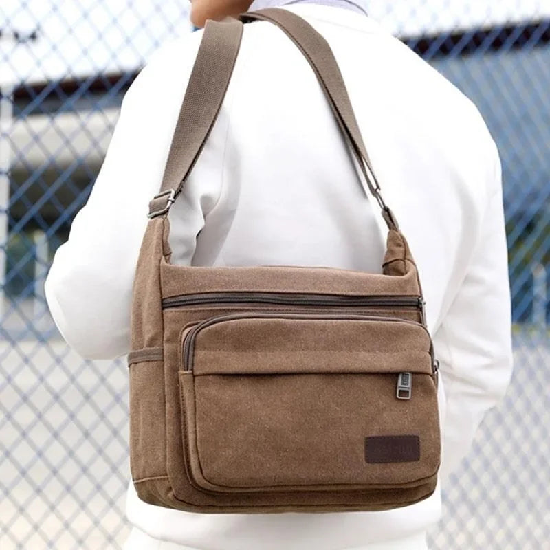 Canvas crossbody messenger bag with adjustable strap and multiple pockets