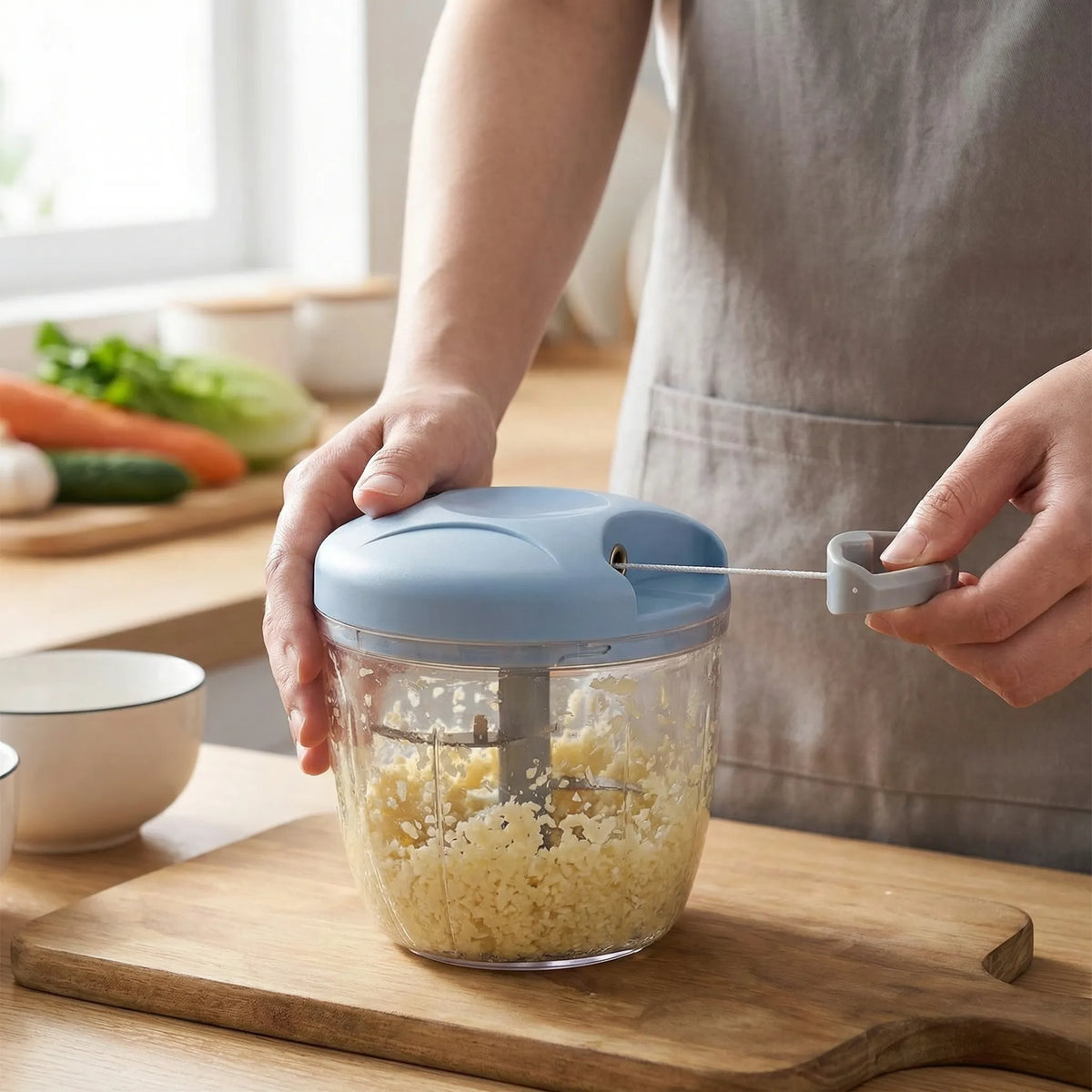 Manual food chopper with non-slip grip for garlic and vegetables