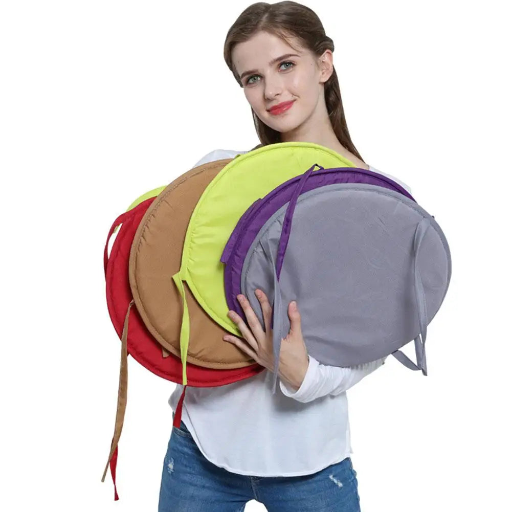 Round seat pad with attachment straps for dining and garden chairs