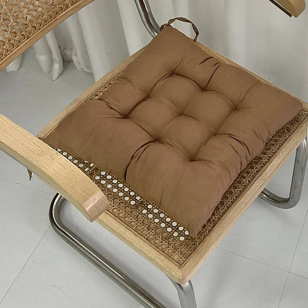Tufted square seat cushion with removable washable cover and secure ties