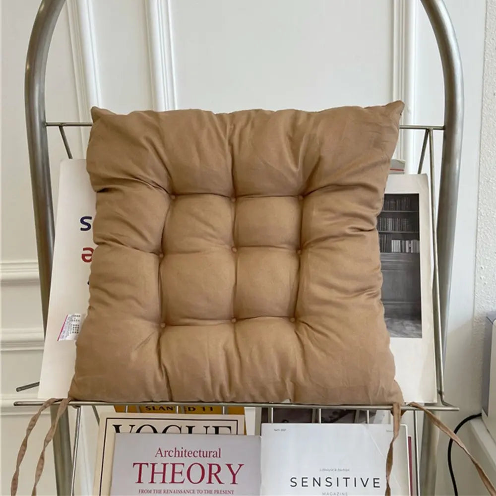 Tufted square seat cushion with removable washable cover and secure ties
