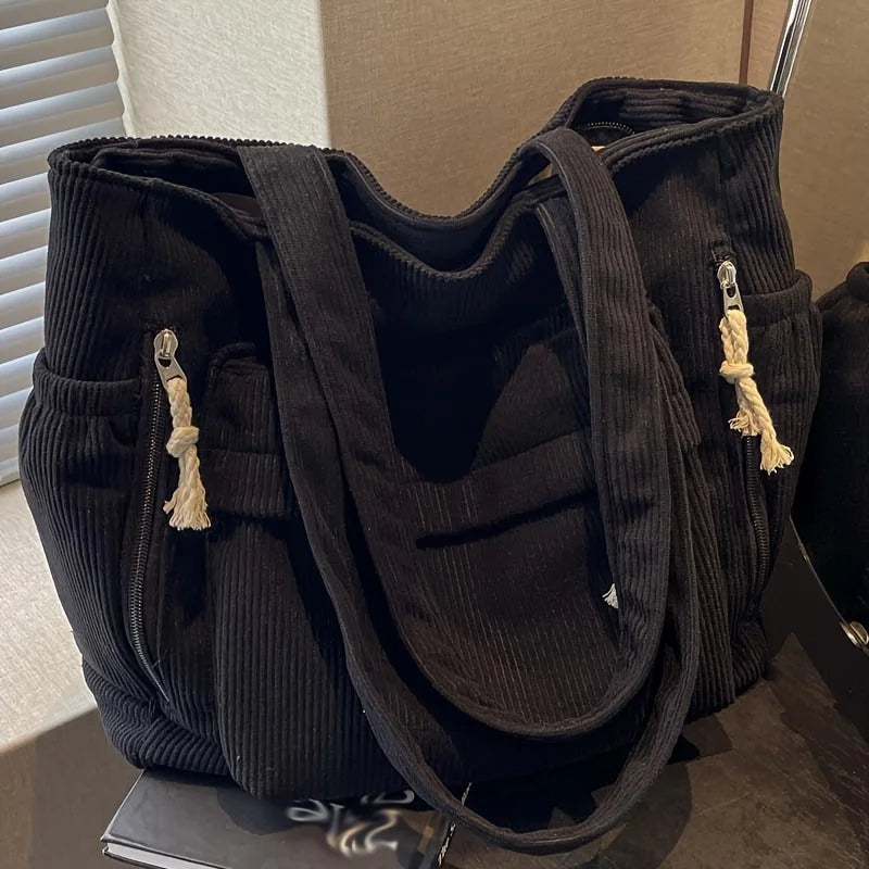 Corduroy shoulder tote with multiple external pockets and rope details