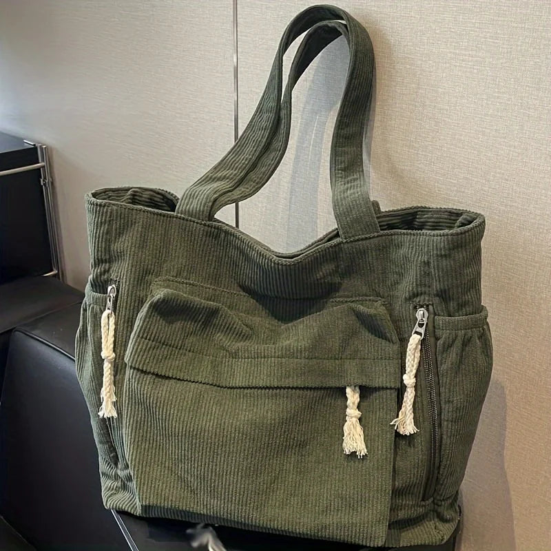 Corduroy shoulder tote with multiple external pockets and rope details