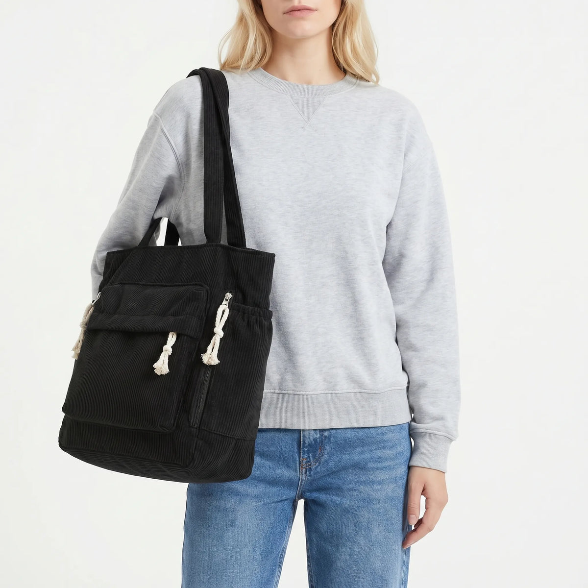Corduroy shoulder tote with multiple external pockets and rope details