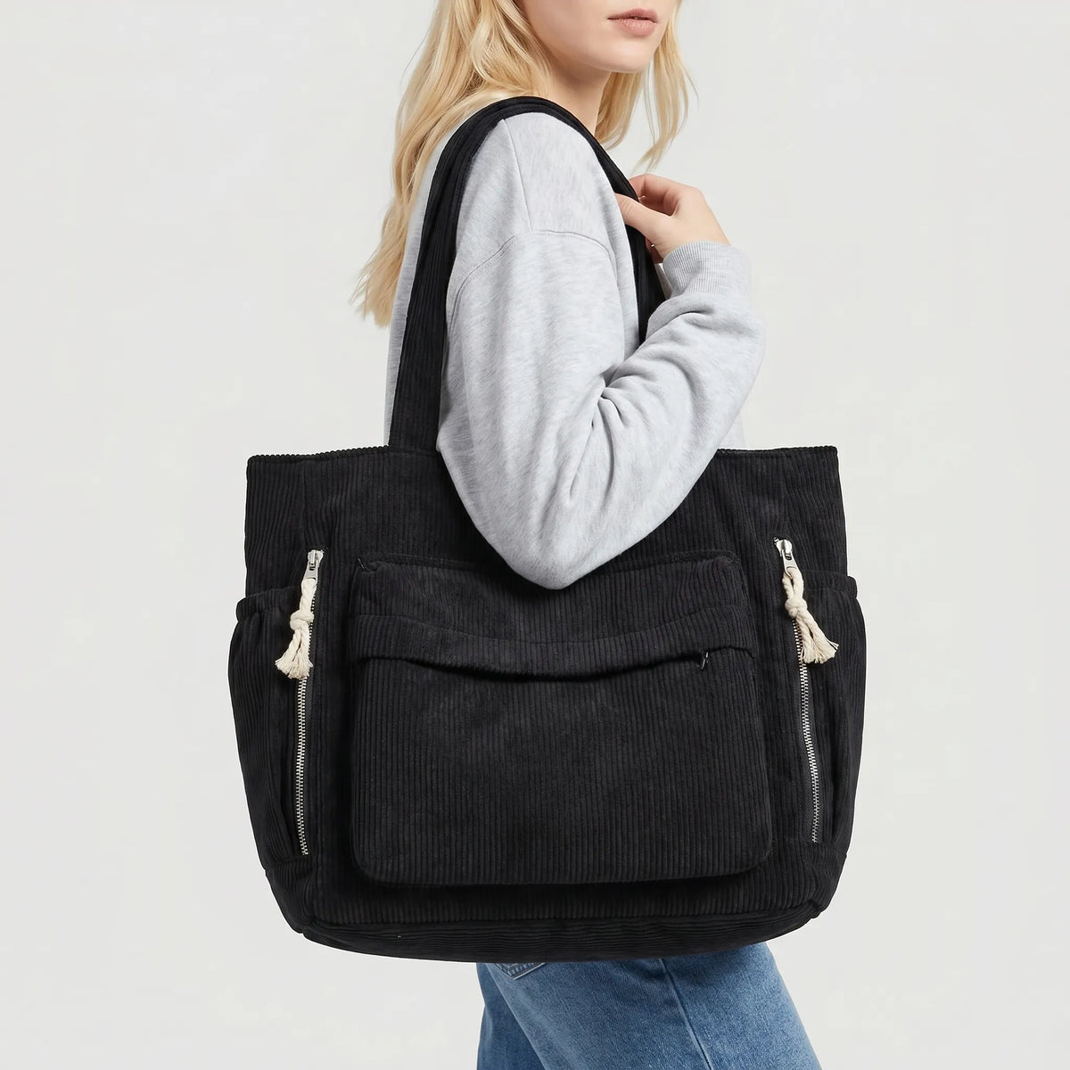 Corduroy shoulder tote with multiple external pockets and rope details