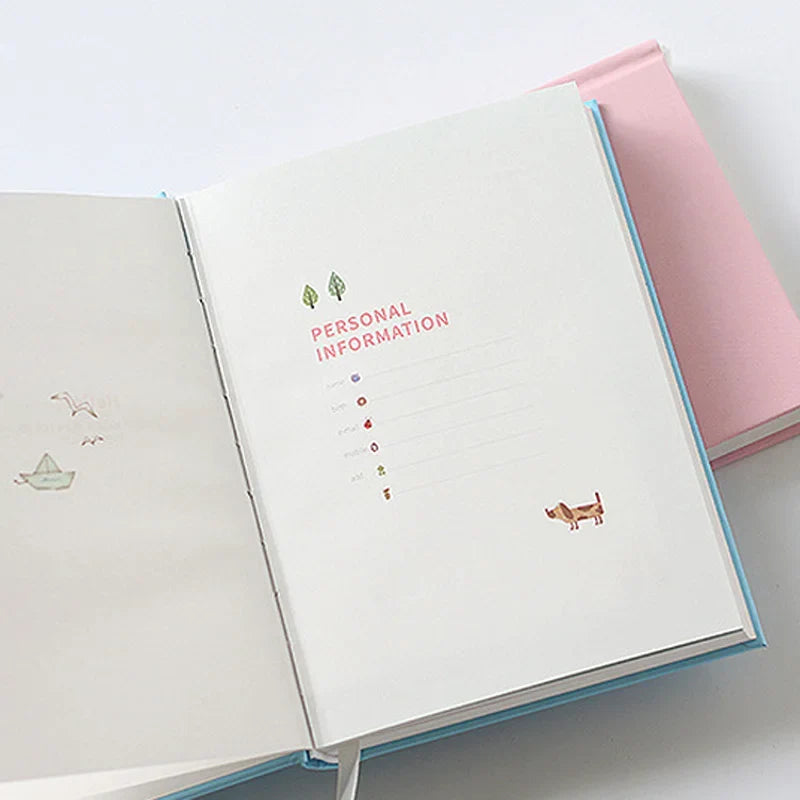 Compact daily planner notebook with colourful illustrated pages