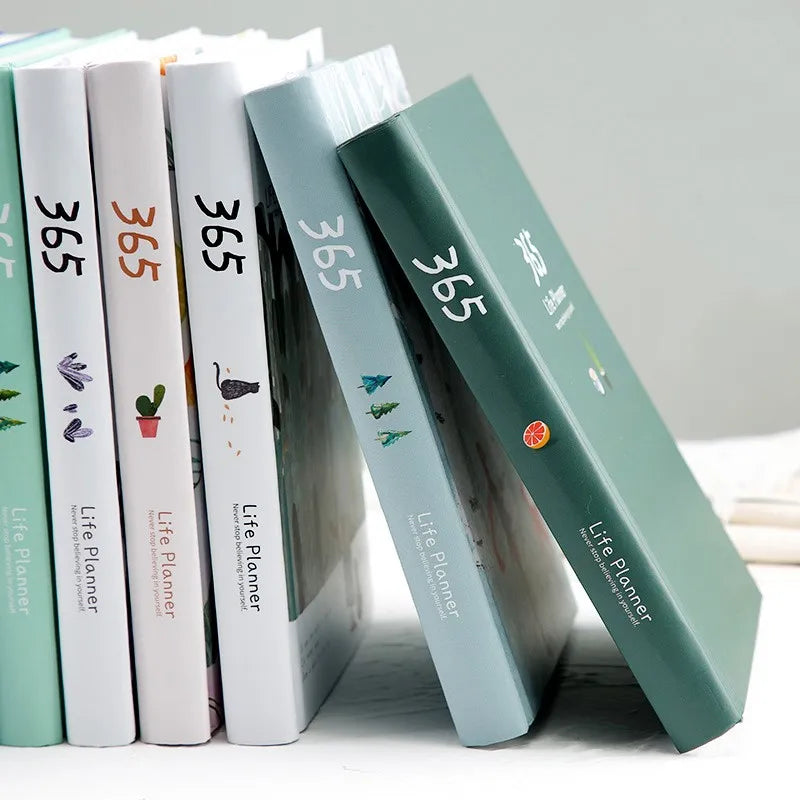 Compact daily planner notebook with colourful illustrated pages